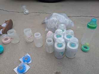 Lot of baby bottles and breast pump funnels