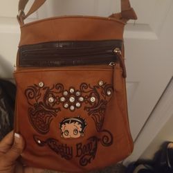 Betty Boop purse with a matching wallet.