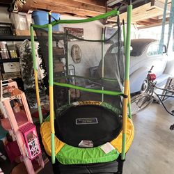 Child’s trampoline with safety net