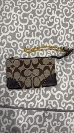 Brown Coach small wristlet.