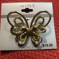 Nine West  Gold Butterfly Brooch Garnished With Light Green Sparkling Stones 