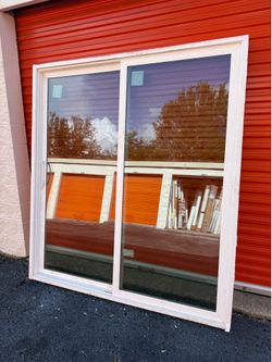 JELD-WEN V-4500 IMPACT RATED 72-in x 80-in x 4-9/16-in Jamb White Vinyl Left-hand Sliding Patio Door with Low-E Glass