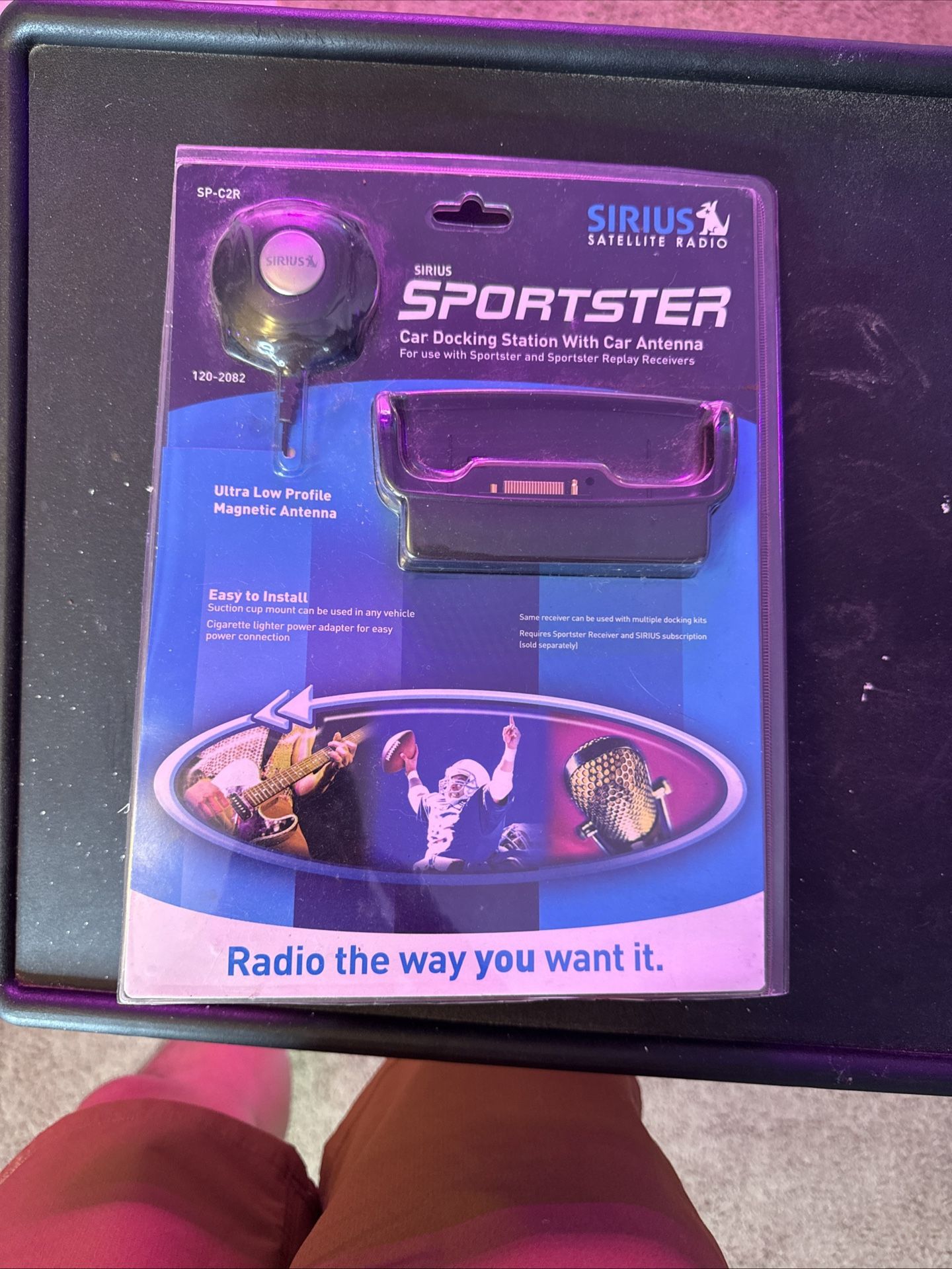 The Sirius SP H2 Sportster Home Docking Station Home Antenna is a sleek black desktop device designed for SiriusXM satellite radio users. This model i