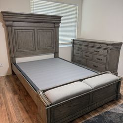 Queen bed frame with matching dresser and box spring.