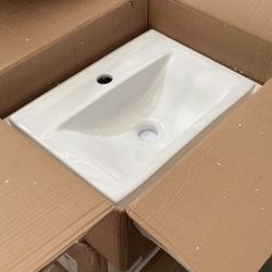 White Sink With Drain. 