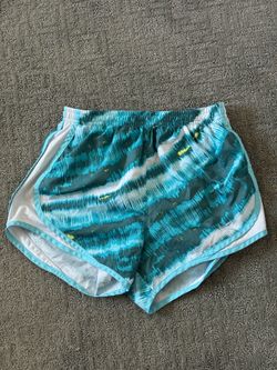 Nike teal and white running shorts