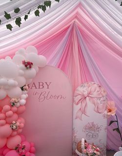 Baby in bloom arch background