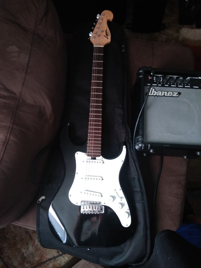Washburn lyon strat. Missing high E string but plays and sound really good.