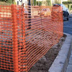 Orange construction, fencing, and trailer