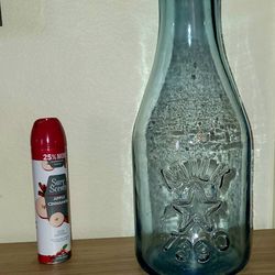 Giant glass embossed 1890 milk bottle