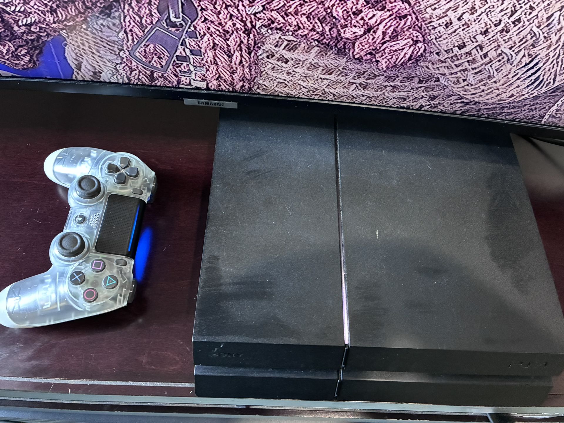 PS4 With Controller And A Game