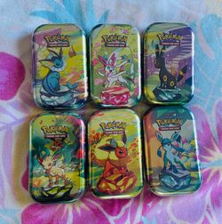 Prismatic Evolutions Mini Tin