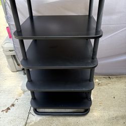 This could be used as an organizational piece in a bedroom and office. It could be used for records or to put any trinkets on. It’s metal and black wo