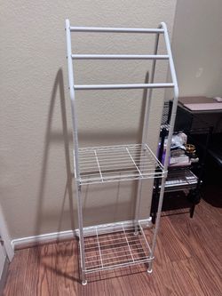 white metal freestanding space-saver shelf