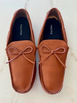 A pair of brand new brown leather Nautica casual shoes