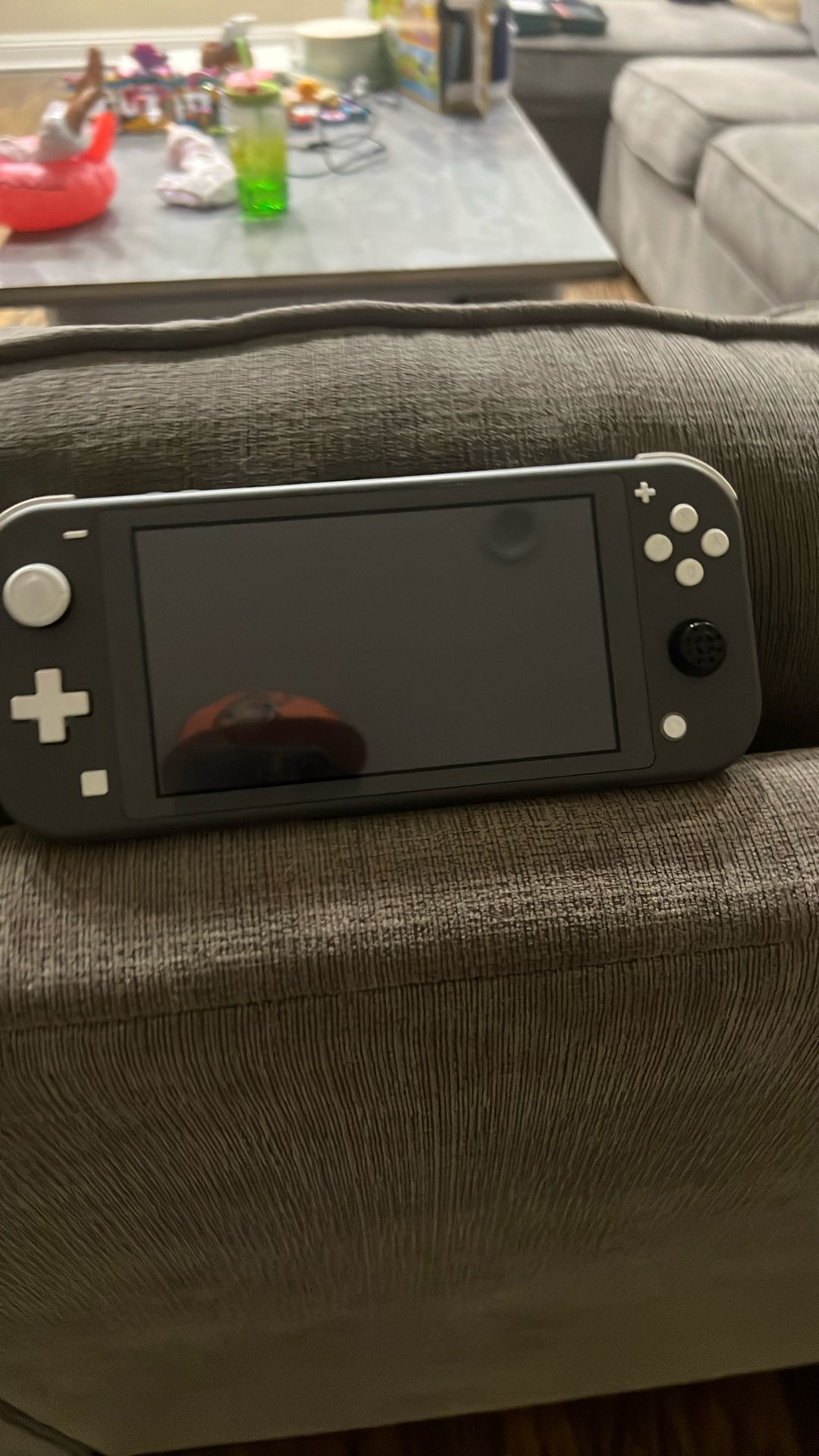 Grey Nintendo Switch Lite With Super Mario Wonder