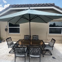 Hampton Bay table, 6 chairs,  Sunbrella (unbrella) 