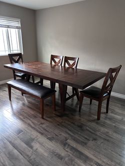 Large sturdy dining table with bench and chairs