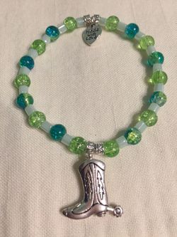 Handmade Stretch Bracelet with Glass Beads and Charm. 130