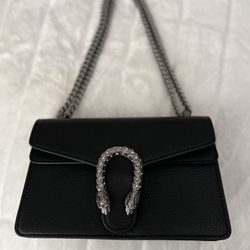  Handbag, black leather. NEW  10”L X 6”H 