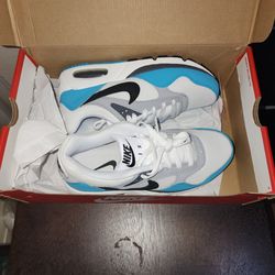 Nike Air Max Correlate women's sneaker in a white, blue, gray, and black colorway.