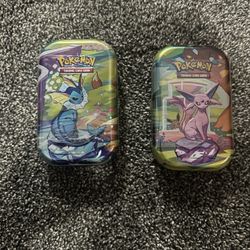 Prismatic Evolution Tins