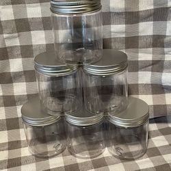 Six plastic screw top Containers