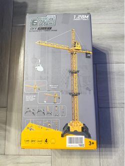 Impressive 1.28-meter tall remote-controlled tower crane with alloy components. This yellow and black construction toy has a 4-channel R/C system and 