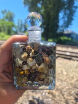 Gems and stones ina bottle.