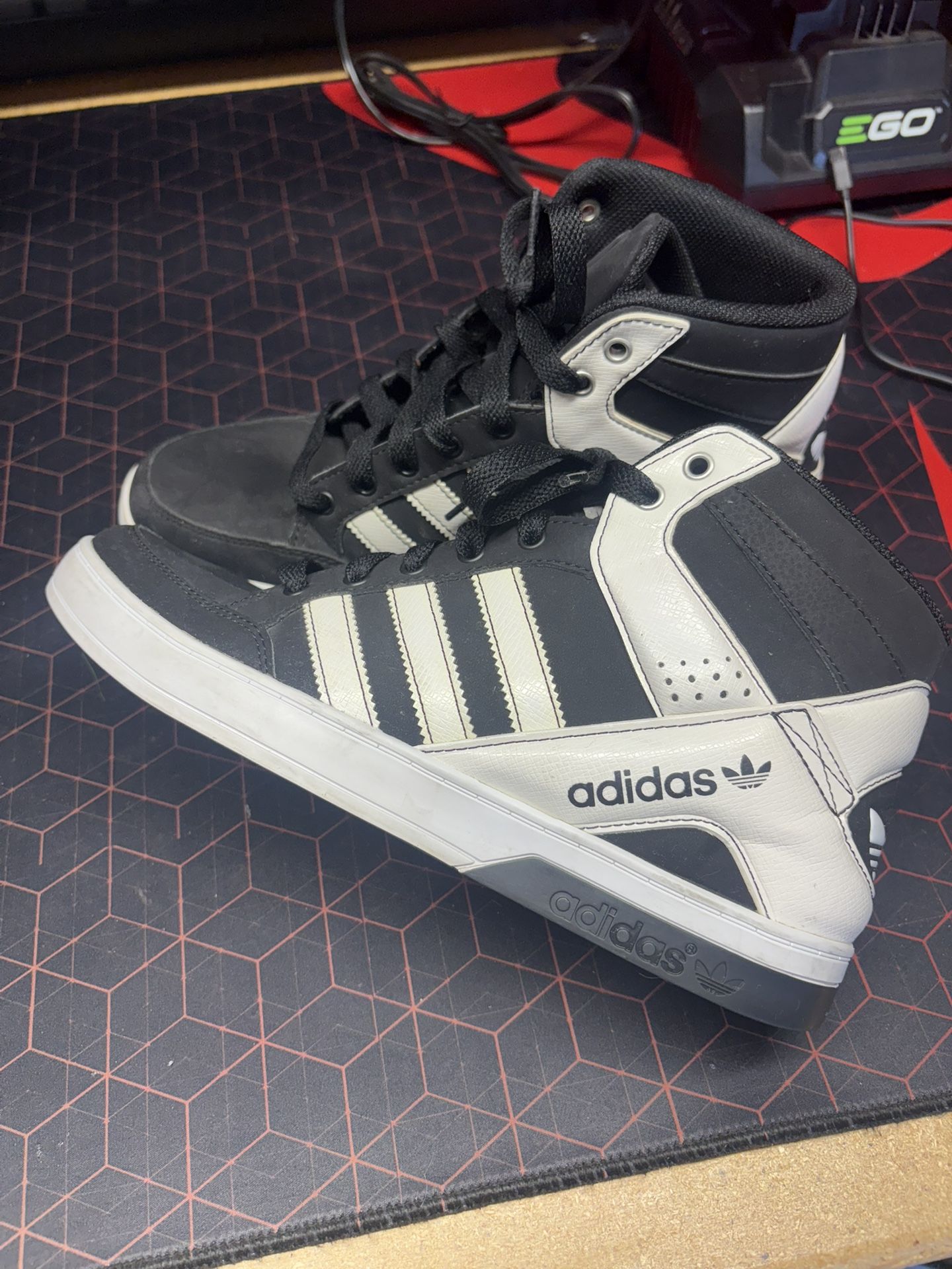 Size 8  Adidas Hardcourt Defender high-top sneakers.