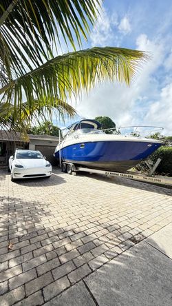 Blue and White Cabin Cruiser Boat