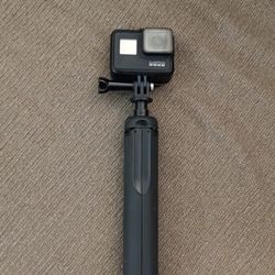 go pro hero 7 with 2 batteries and tripod selfie stick 
