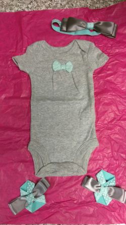 Baby barefoot sandals, headband, and matching onesie.