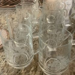 Clear Eight Glass Coffee Mugs With Etched Flowers On Mug. 