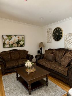 2 dark wood sofas