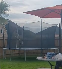 14' feet trampoline w/ safety net .(Good condition)