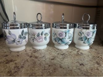 Royal Worcester porcelain egg coddlers featuring floral patterns like "Woodland" or "June Garland