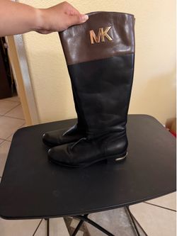 MICHAEL Michael Kors  Two-Tone Leather Riding Boot ...Michael Kors two-tone riding boots, often featuring a black and brown leather design with gold h