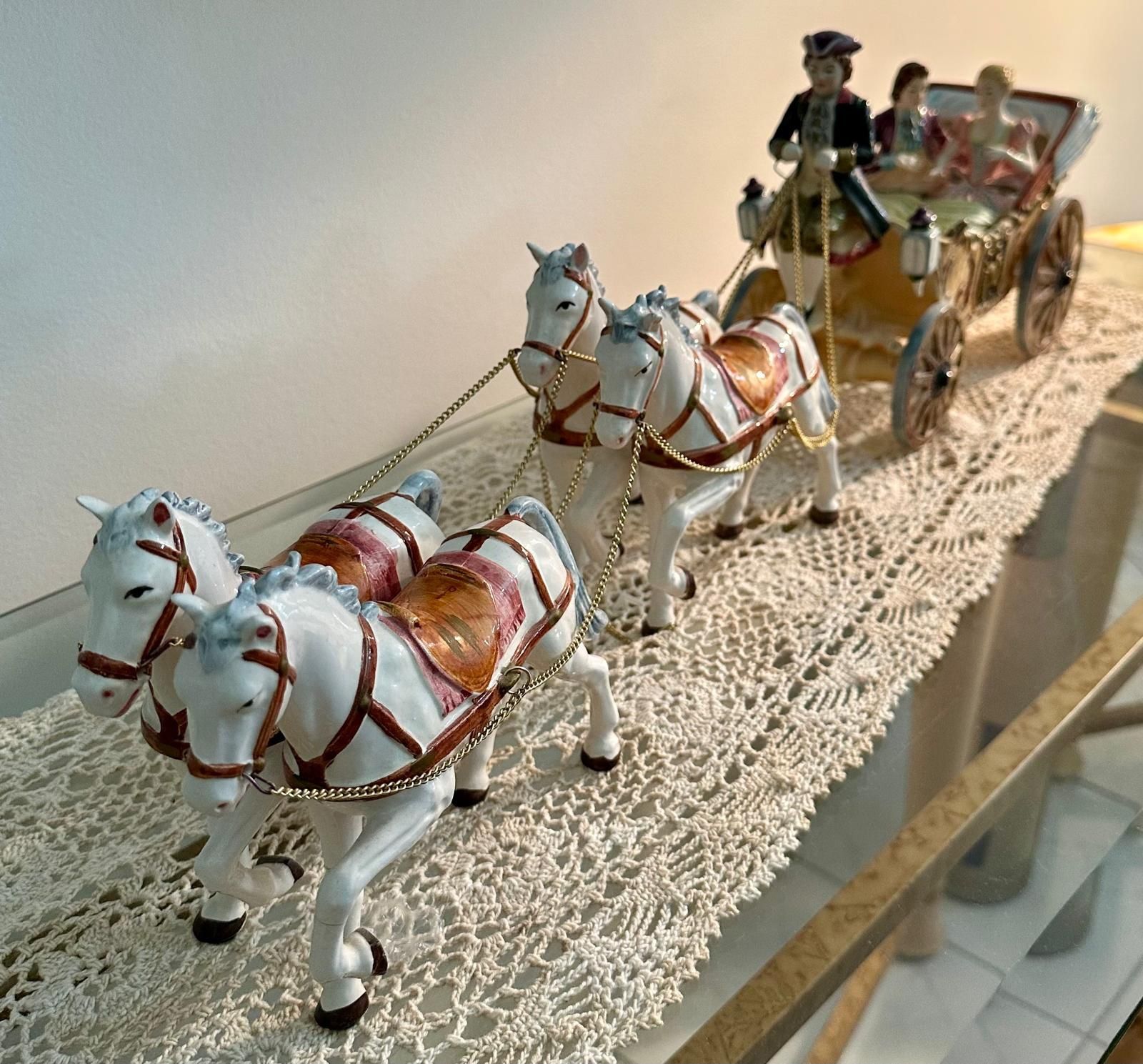 Elegant Hand-Painted Porcelain Horse-Drawn Carriage Figurine. 