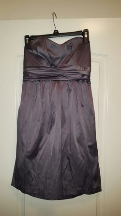 Strapless gray color party dress. Has side pockets. Zipper tied in back with stretchable material. Size L. Perfect condition.