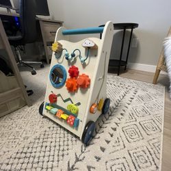 B. toys Wooden Activity Walker