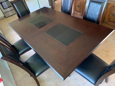Wooden kitchen table with 2 opening 6 chairs and a leaf