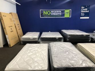 New Mattresses Still in Plastic Wrap