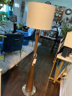 A Brushed Nickel finish Metal and wood torchiere floor lamp 61” floor lamp