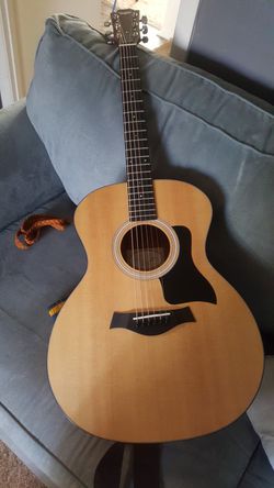 Taylor acoustic electric guitar Bran New.