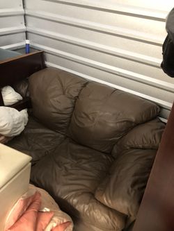Leather loveseat and chair One center table 2 end tables 2 lamps for 350