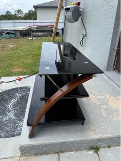 Good TV STAND  black and wood color about 65 inches