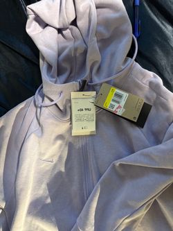 a light purple Nike Dri-FIT hoodie featuring an attached UPF 40+ sun protection tag.