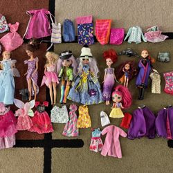 Assorted Dolls and Accessories! Collection of dolls with various outfits and accessories.