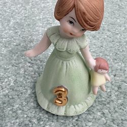 Vintage 1987 Enesco age 3 brunette, porcelain figurine from the growing up girls collection